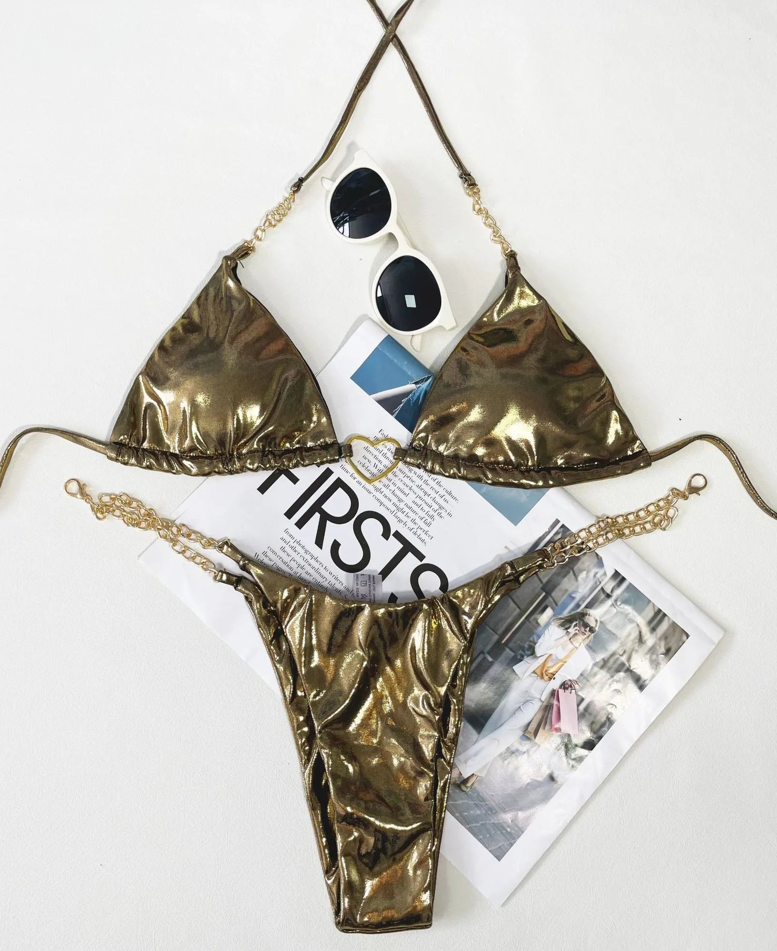 Women's sleeveless polyester bikini swimsuit in gold, shown in a triangle style for swimming.