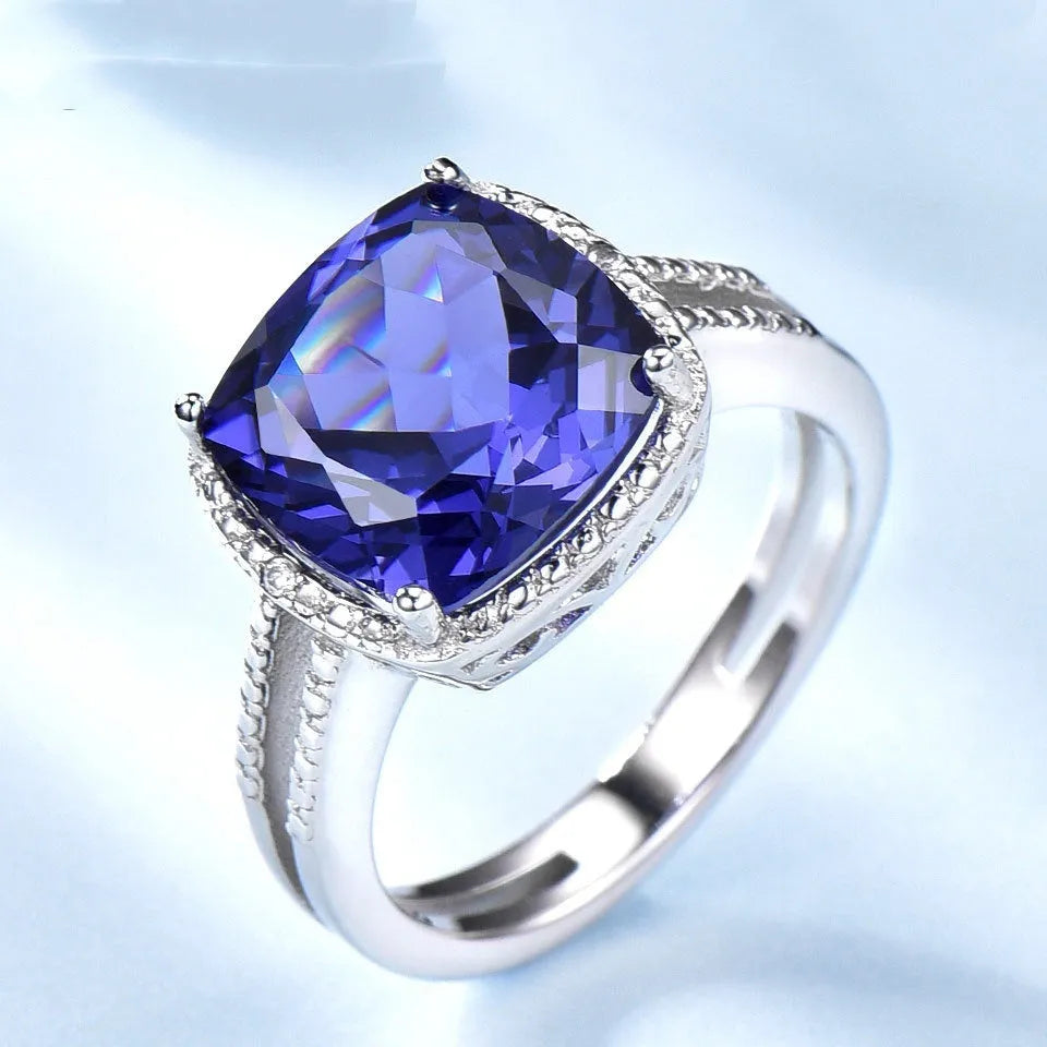 Women's sterling silver ring with a blue tanzanite gemstone.