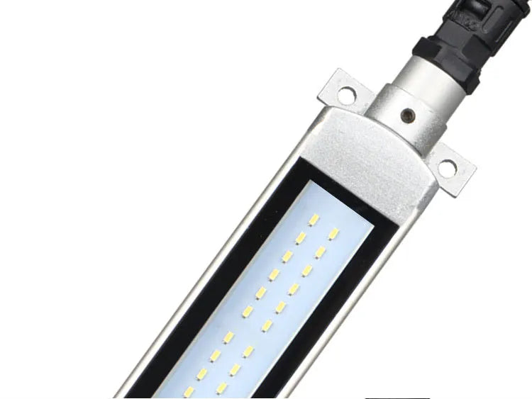 Long aluminium LED explosion-proof light strip with tempered glass cover for CNC lathe mounting.