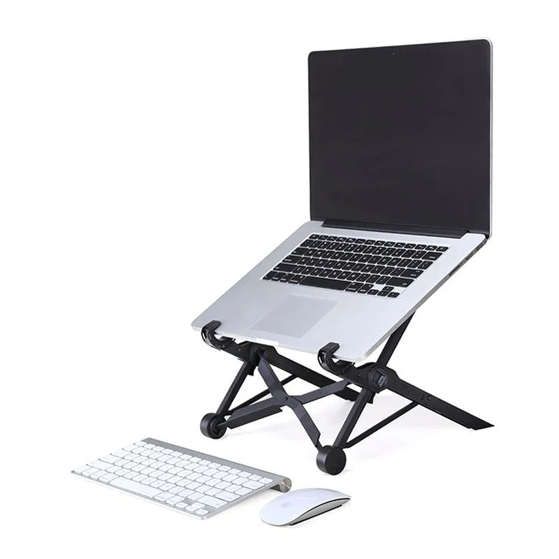Sagacious black portable folding laptop stand bracket on a desk next to a laptop.