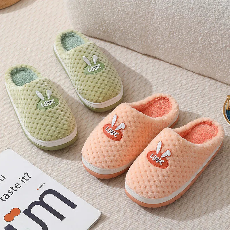 Women's plaid design house slippers with artificial fur upper and thick rubber sole in various colours.