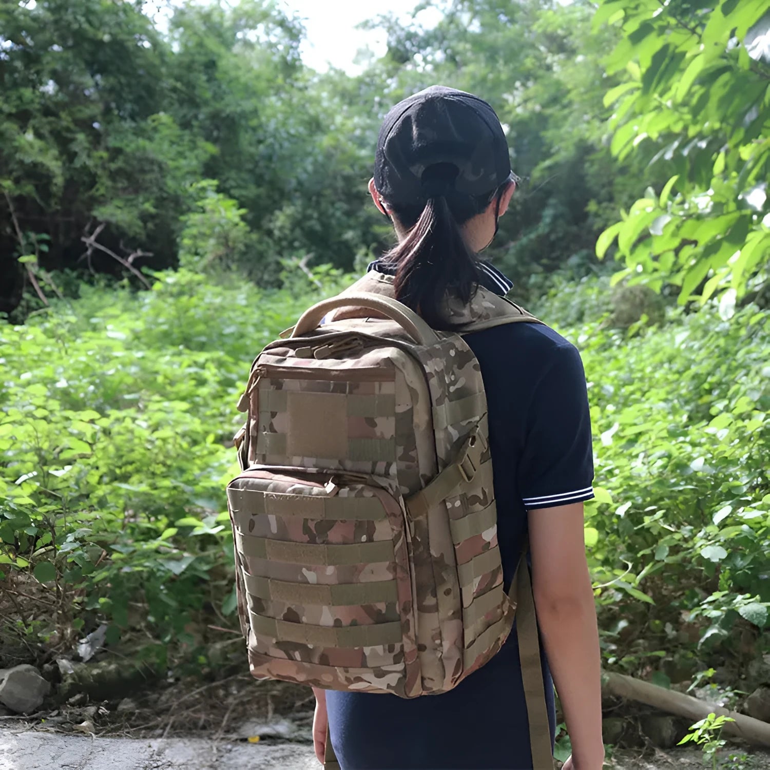 Black military-style tactical assault backpack made from Oxford fabric, shown with adjustable straps.