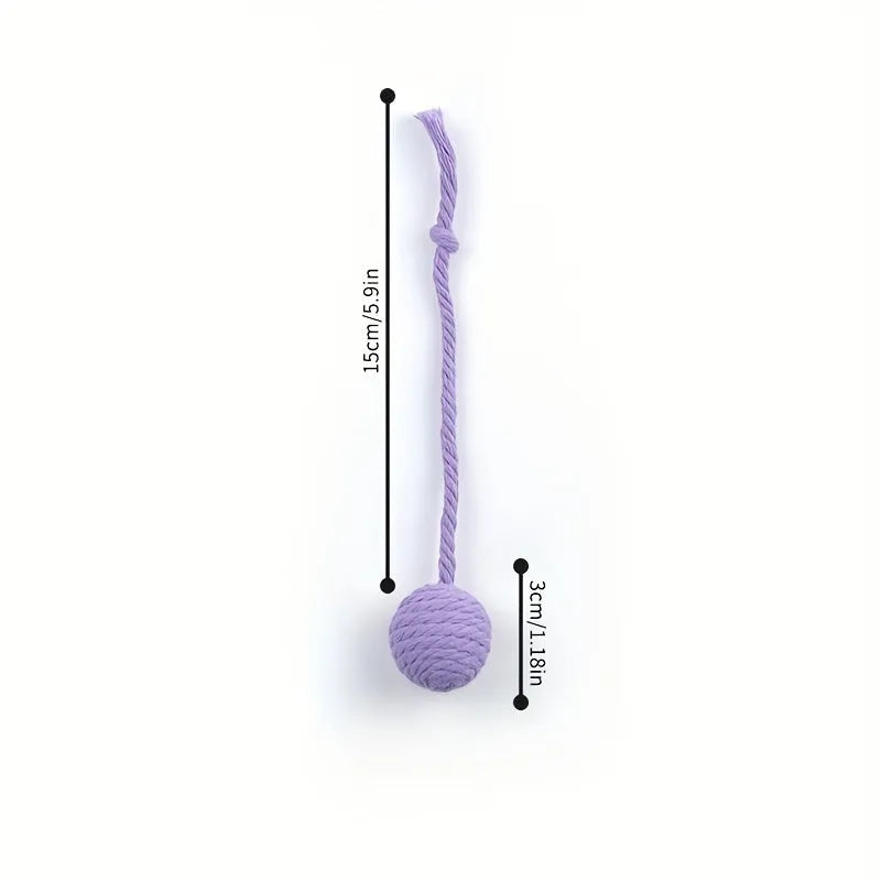 Cat toy ball with integrated rope and bell in green pink purple yellow colours