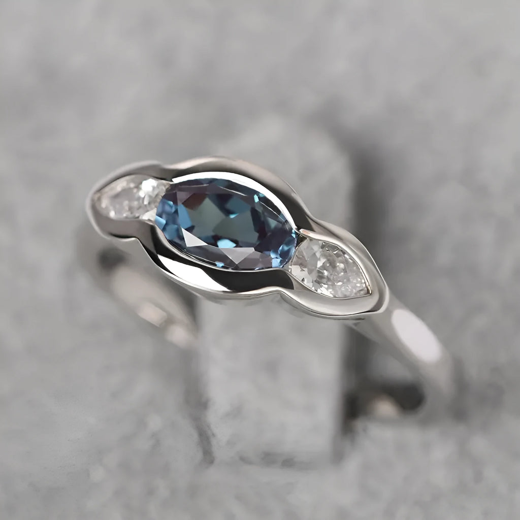 Geometric ellipse ring with zircon stones in white gold finish showing elliptical shape