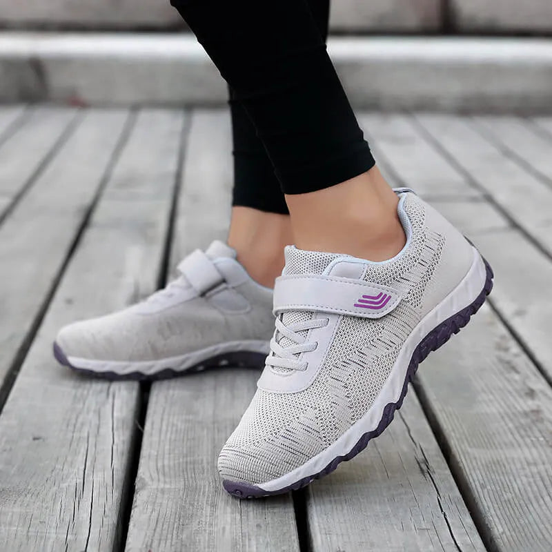 Women's low-top grey purple wedge shoes with Velcro strap and breathable mesh upper.