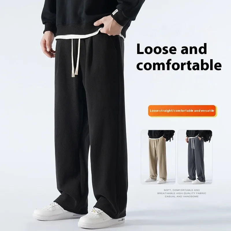 Man wearing apricot coloured double-sided polar fleece winter trousers with a loose fit and drawstring waist.