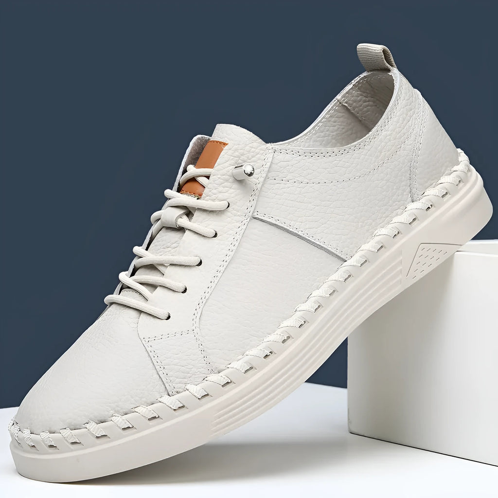 Men's beige and black cowhide leather sneakers with round toe and mesh lining.