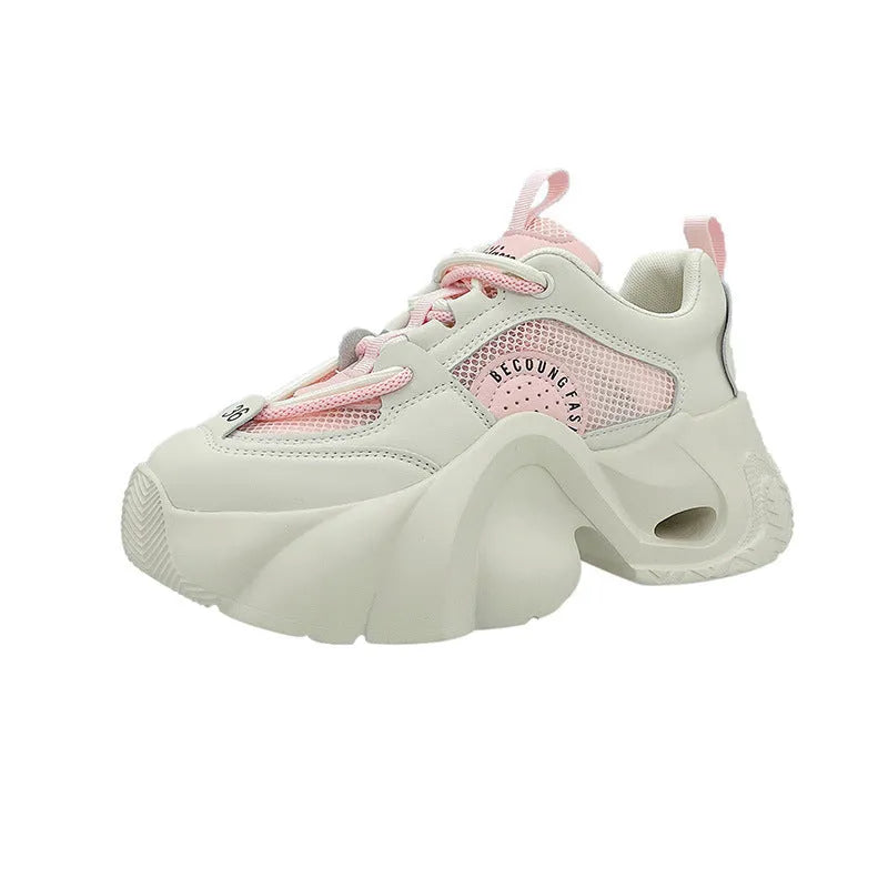 Women's pink sneakers with cross strap design and thick platform sole