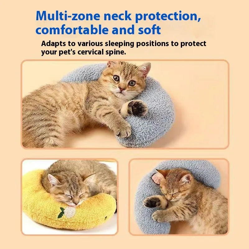 Blue and yellow U-shaped cloth pillows for cats in moon and question mark designs.
