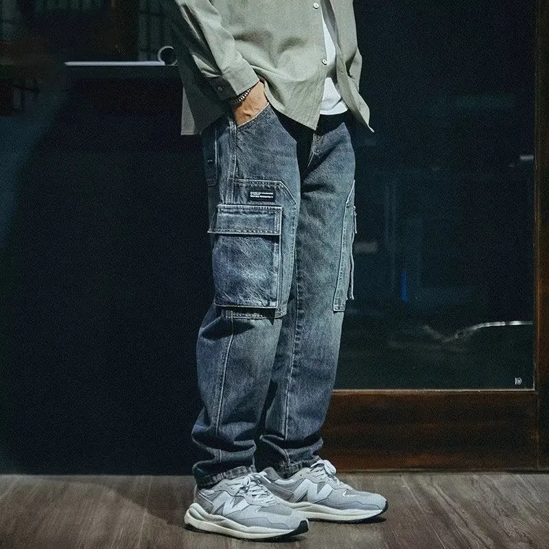 Man wearing blue loose straight leg stretch jeans in a casual setting