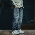 Man wearing blue loose straight leg stretch jeans in a casual setting