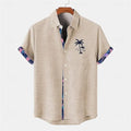 Linen loose-fit casual short-sleeve shirt with a blue ocean fish pattern, laid flat.