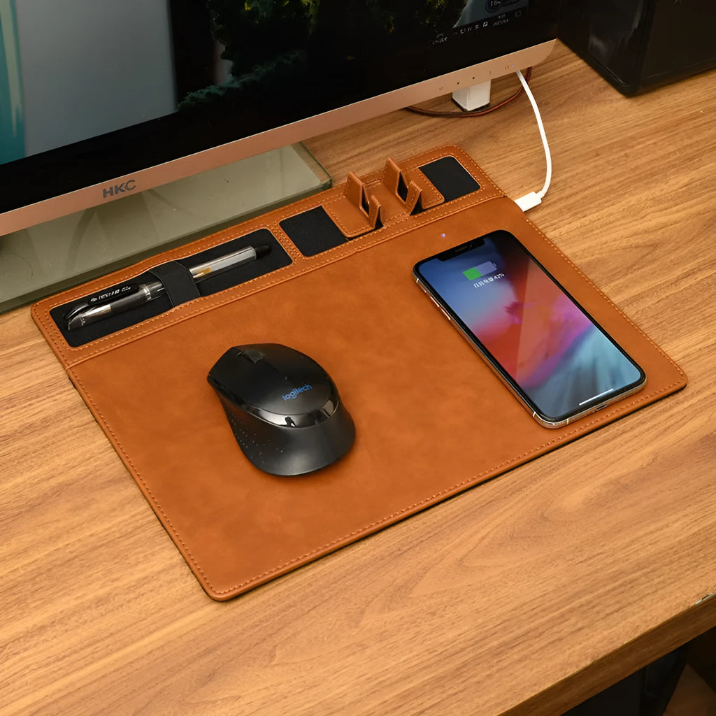 Pink wireless charging mouse pad with mobile phone holder on a desk