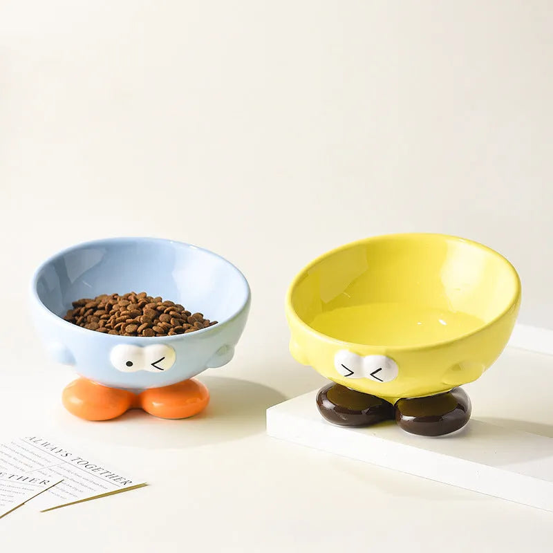 Blue oblique tall ceramic pet bowl with a cute expression design for cats and dogs.