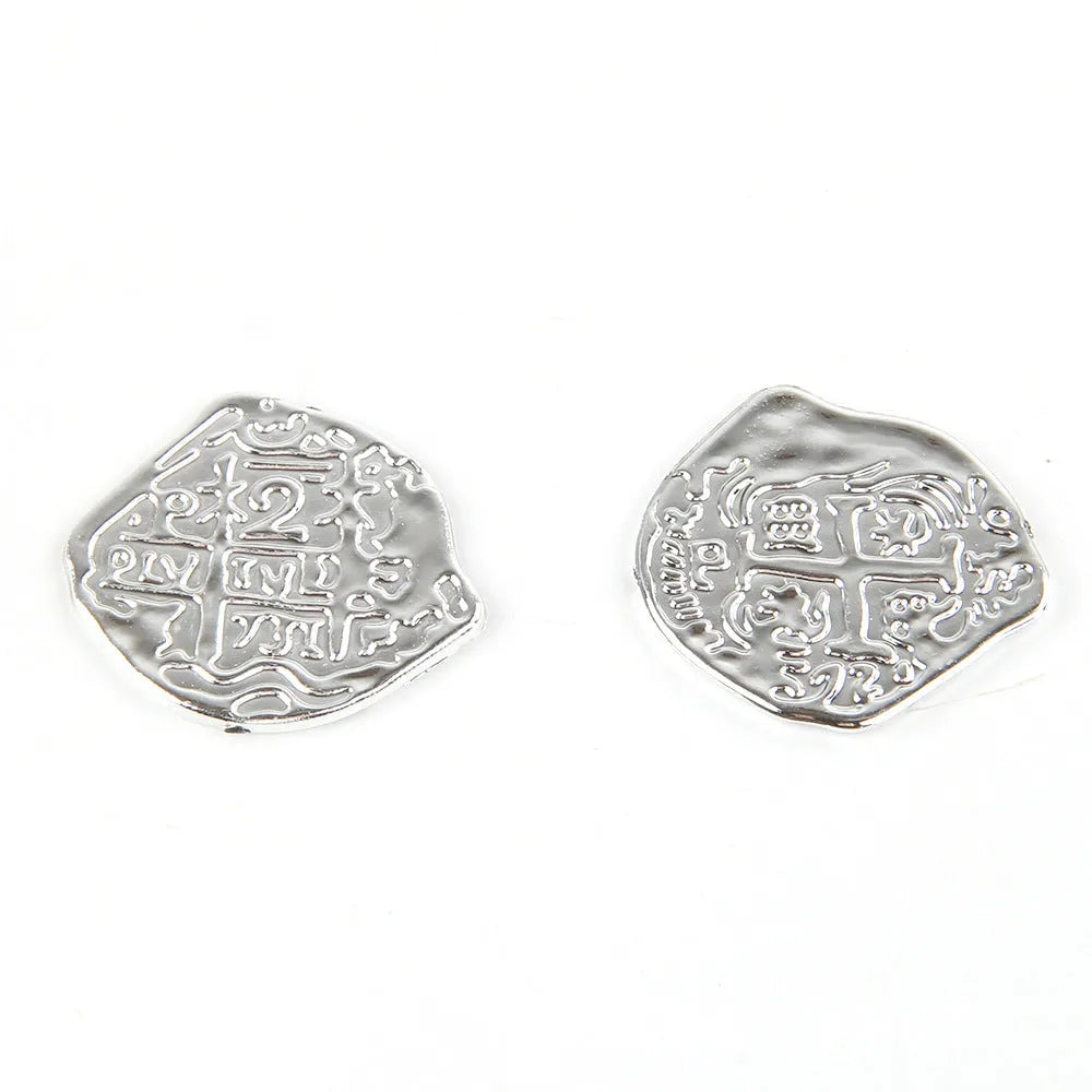 Set of 100 electroplated plastic Roman coins in a pile, showing gold, silver, and bronze metallic finishes.