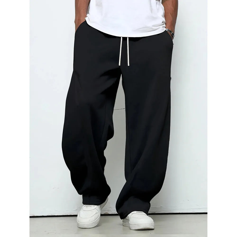 Men's straight-leg polyester casual trousers in black with a drawstring elastic waistband.