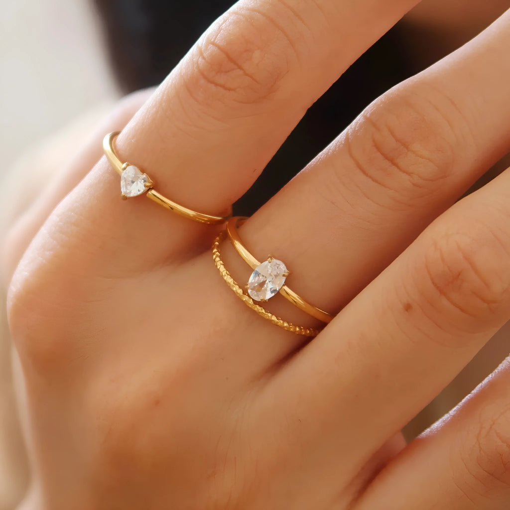 Golden electroplated stainless steel love heart ring for women showing heart shape.