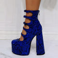 Women's black waterproof platform high heels with a thick heel, serpentine belt, and buckle fastening.