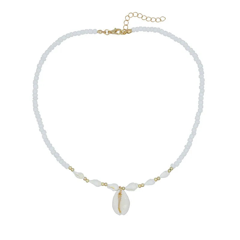 White conch shell bead necklace with a detailed mother pearl shellfish pendant on a regular chain.