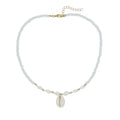 White conch shell bead necklace with a detailed mother pearl shellfish pendant on a regular chain.