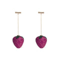 Red geometric strawberry-shaped dangle earrings with spot drill texture on zinc alloy.
