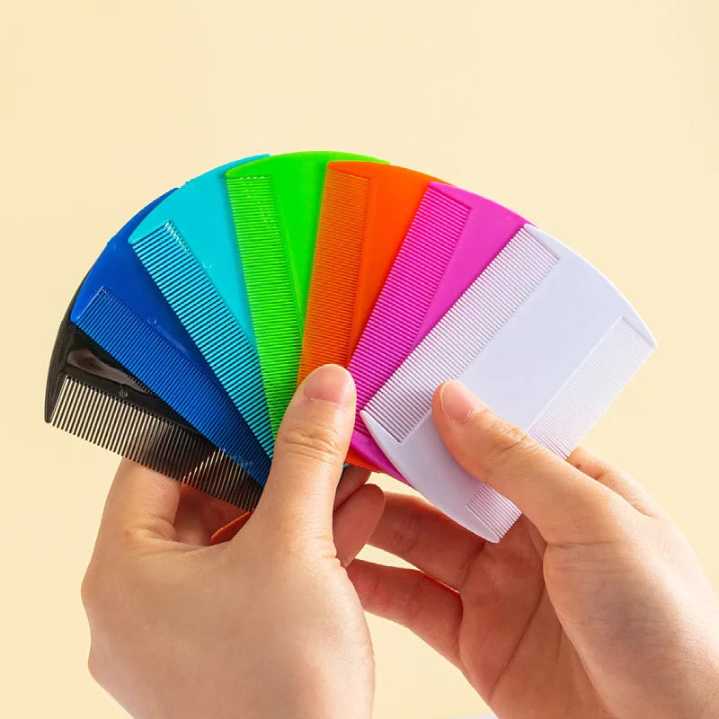 A double-edged fine-toothed plastic flea and lice comb in a selected colour, shown with its size scale.