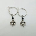 Silver alloy round hoop earrings with a detailed Tibetan antelope silhouette design.