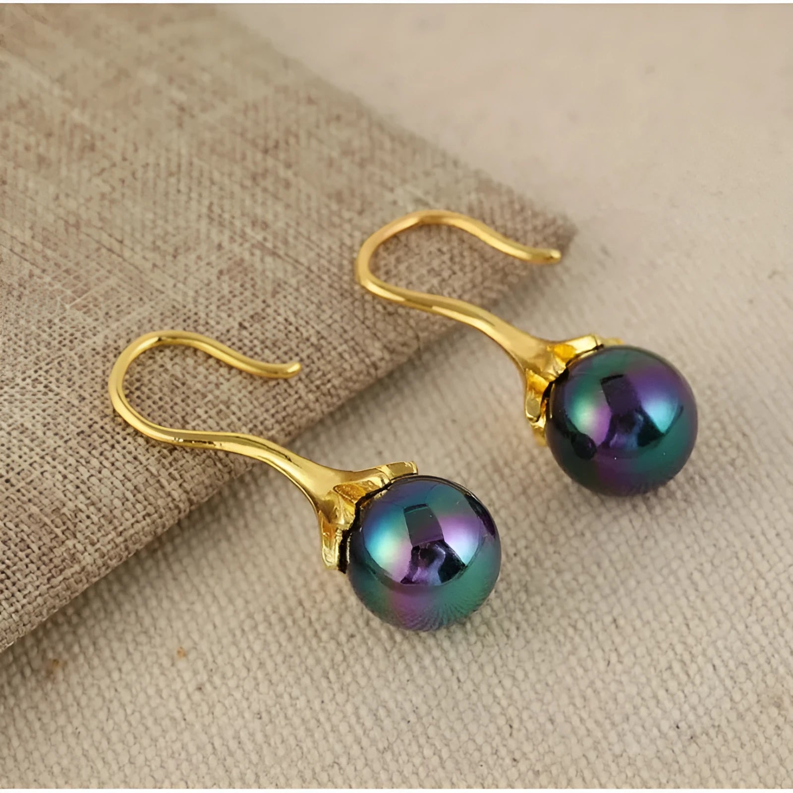 A pair of gold-coloured retro fashion earrings for women, made from electroplated alloy.