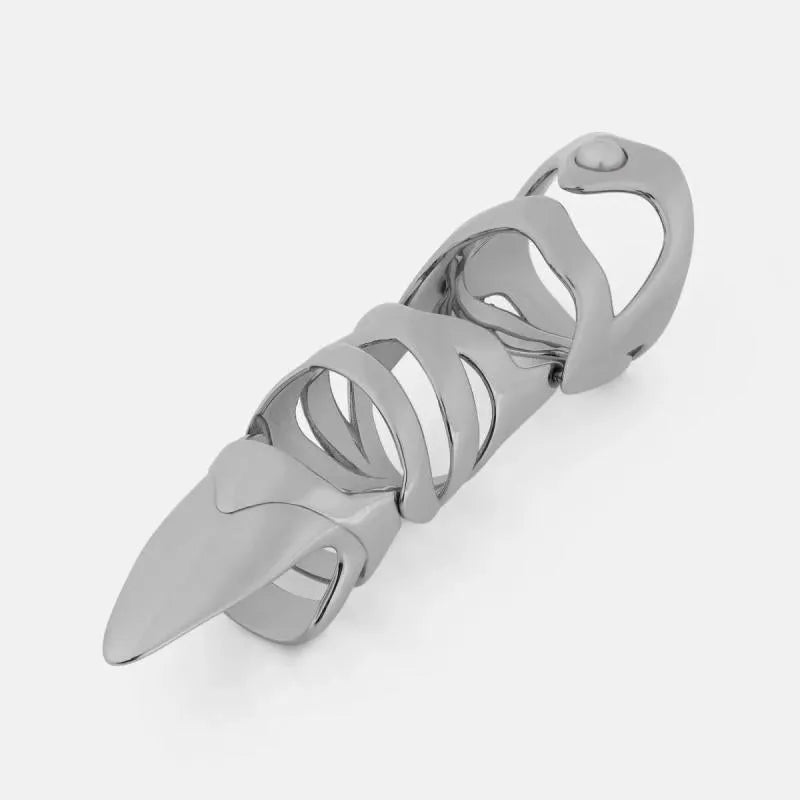 Silver alloy punk armour finger stall fashion ring on a finger.