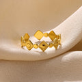 Geometric-shaped titanium steel women's ring in a gold diamond colour.
