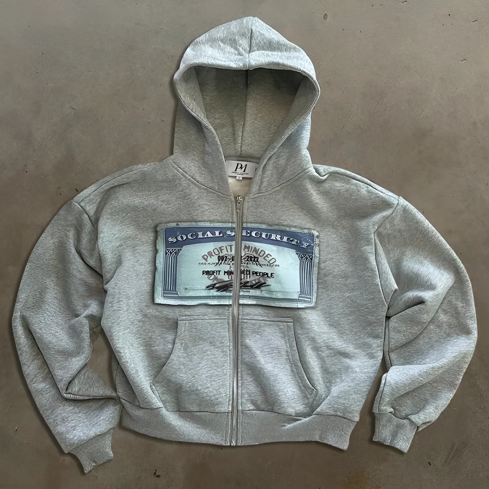 Unisex loose fit hoodie jacket with letters pattern and zipper pockets in black, grey, or pink.