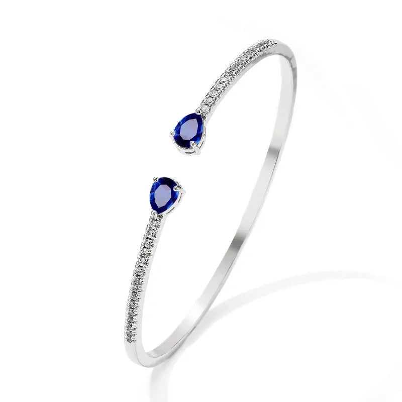 Multi-zircon personalised bracelet with inlaid stones on copper base in white and blue colour options