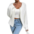 White women's V-neck cardigan sweater with bead-knit texture on a hanger.