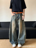 Man wearing retro blue distressed wide-leg denim jeans with machete detailing