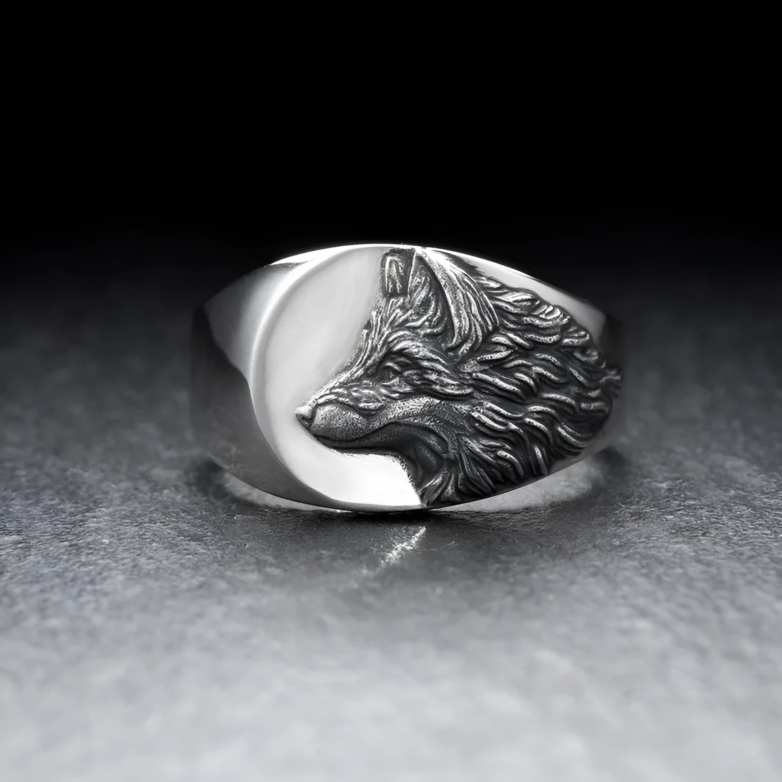 Silver alloy men's ring featuring a geometric wolf head design on a finger.