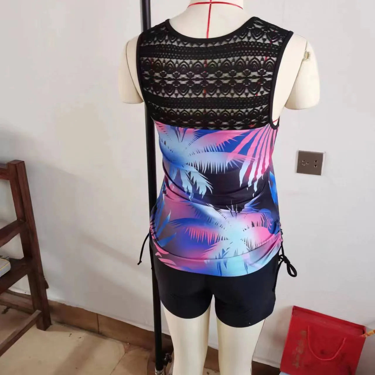 Women's blue lace print two-piece swimsuit showing front and back views