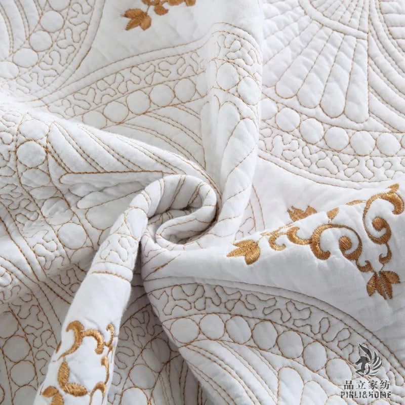 Pure cotton embroidered bed cover set with pillowcases on a double bed.