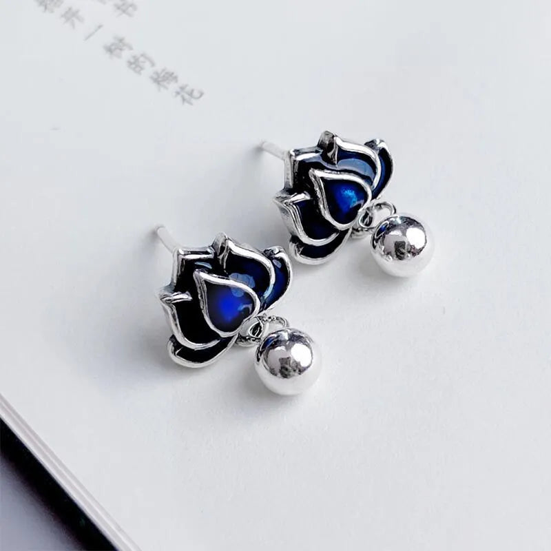 Silver Needle alloy lotus seedpod ear studs with tassel detail, 1.2cm wide.