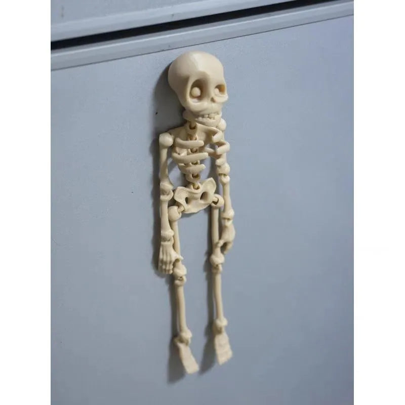 3D printed white skull refrigerator magnet Halloween ornament measuring 18cm tall.