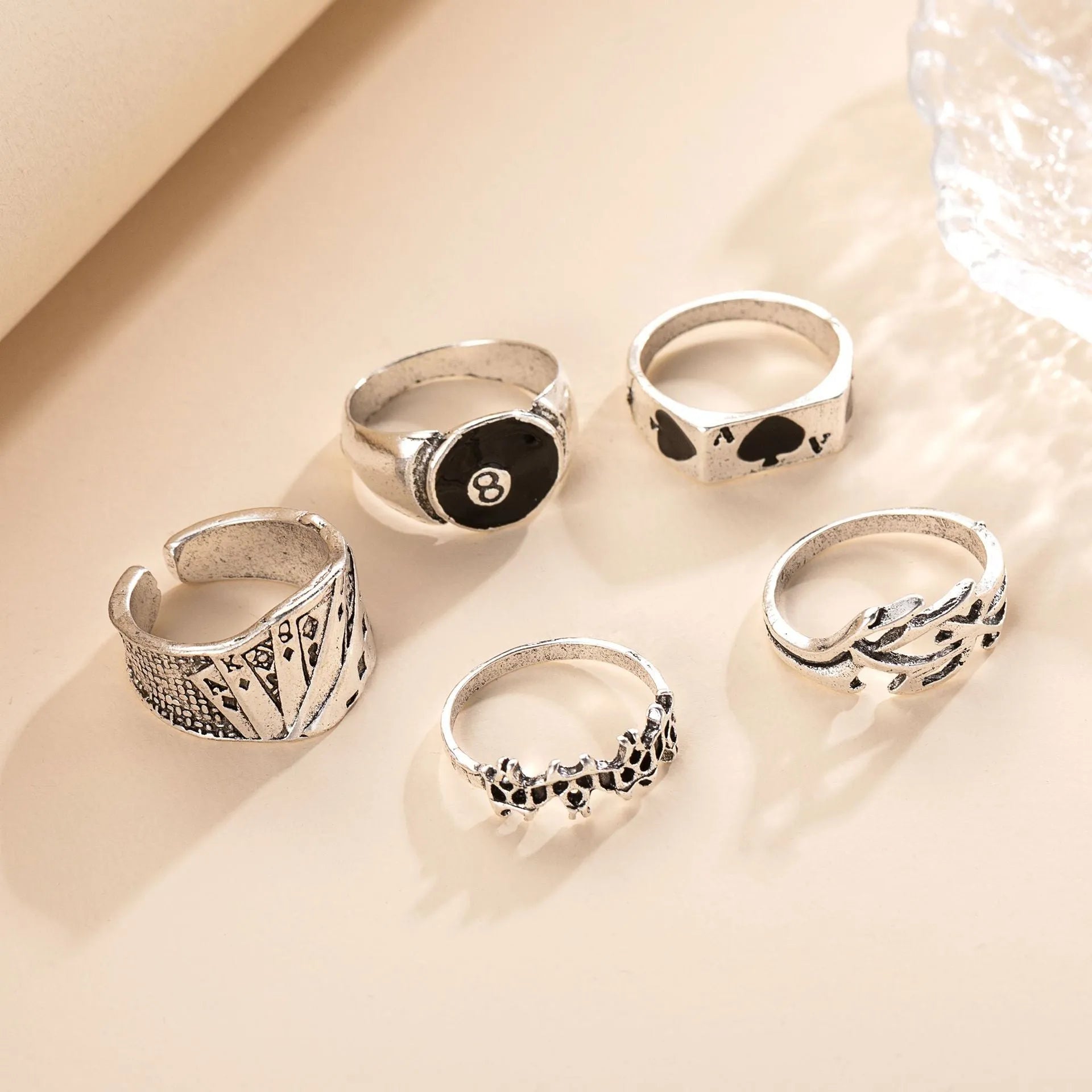 Black alloy poker ring with raised spade card design on adjustable band
