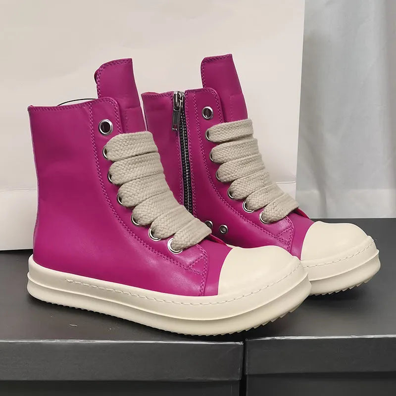 Black high-top leather sneakers with a side zipper and visible stitching on a white background.