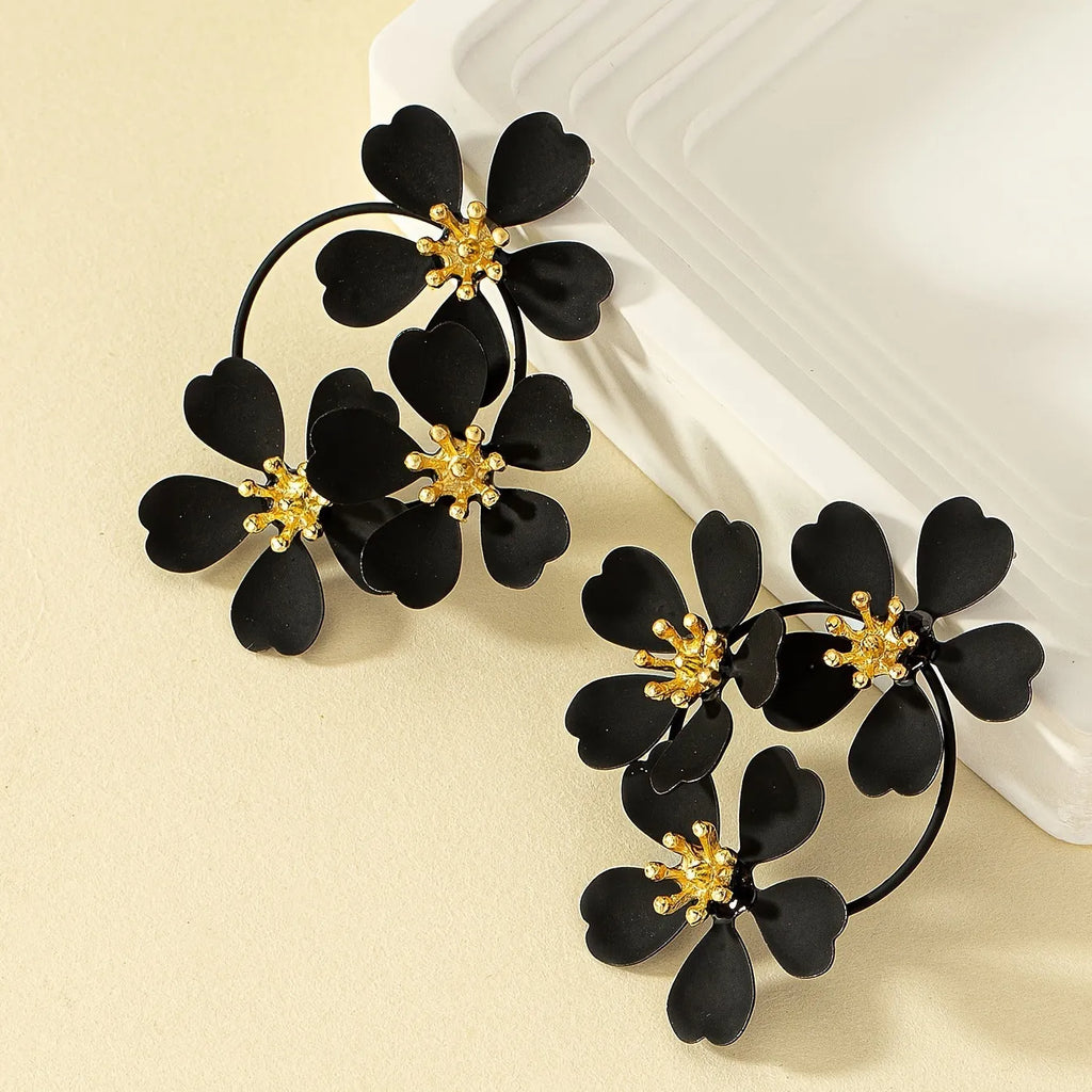 Retro flower earrings for women in black or white with iron construction and baking varnish finish
