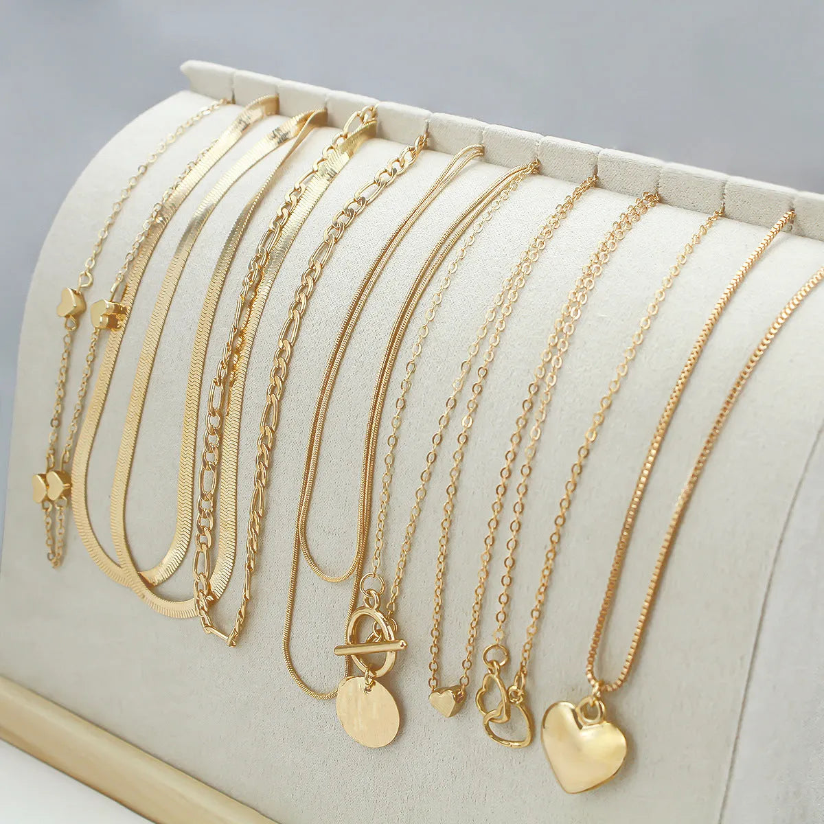 10-piece gold electroplated women's necklace set with simple alloy pendants on snake bone chains