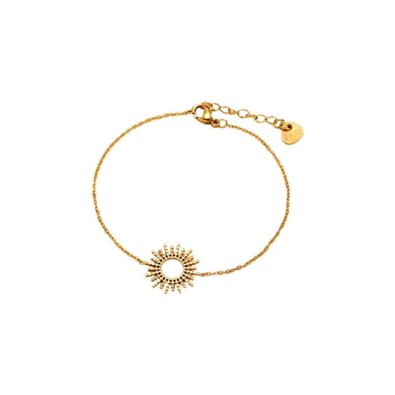 Gold geometric chain necklace and matching bracelet set on a plain background.