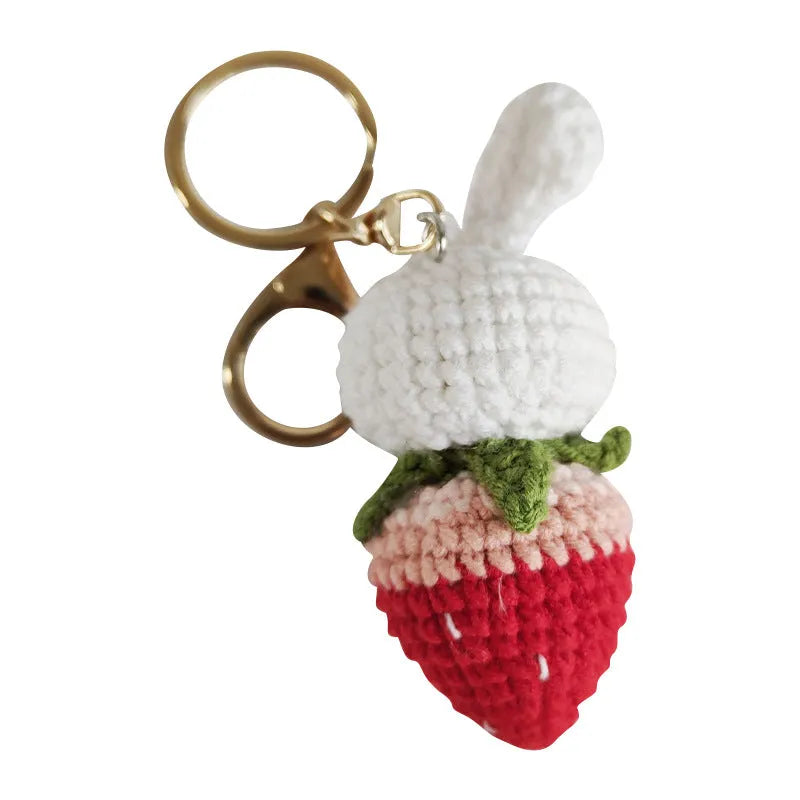Hand-woven colourful wire pendant shaped like a rabbit with a strawberry, featuring a key loop.
