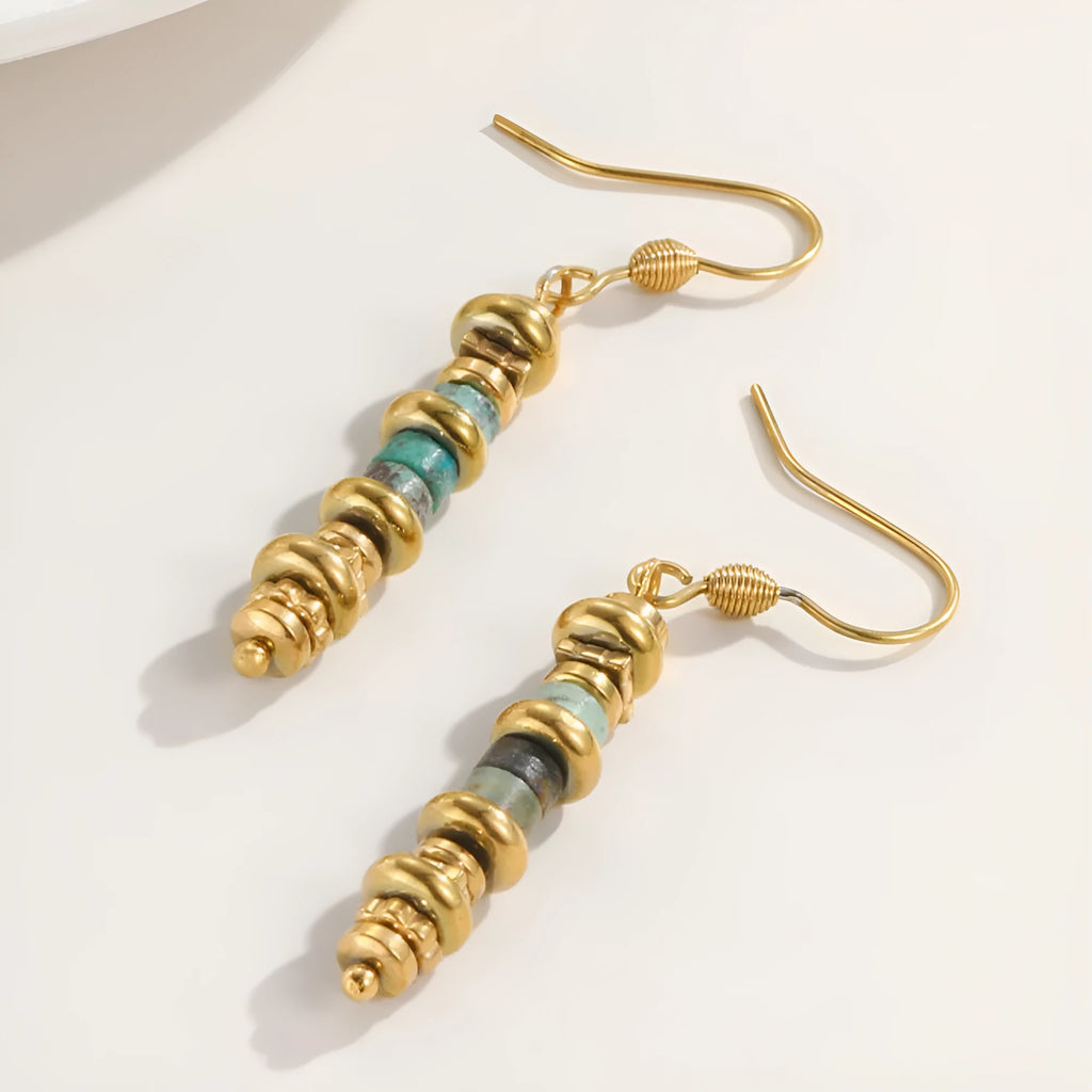 A pair of women's geometric retro dangle earrings in titanium steel with an 18K finish.