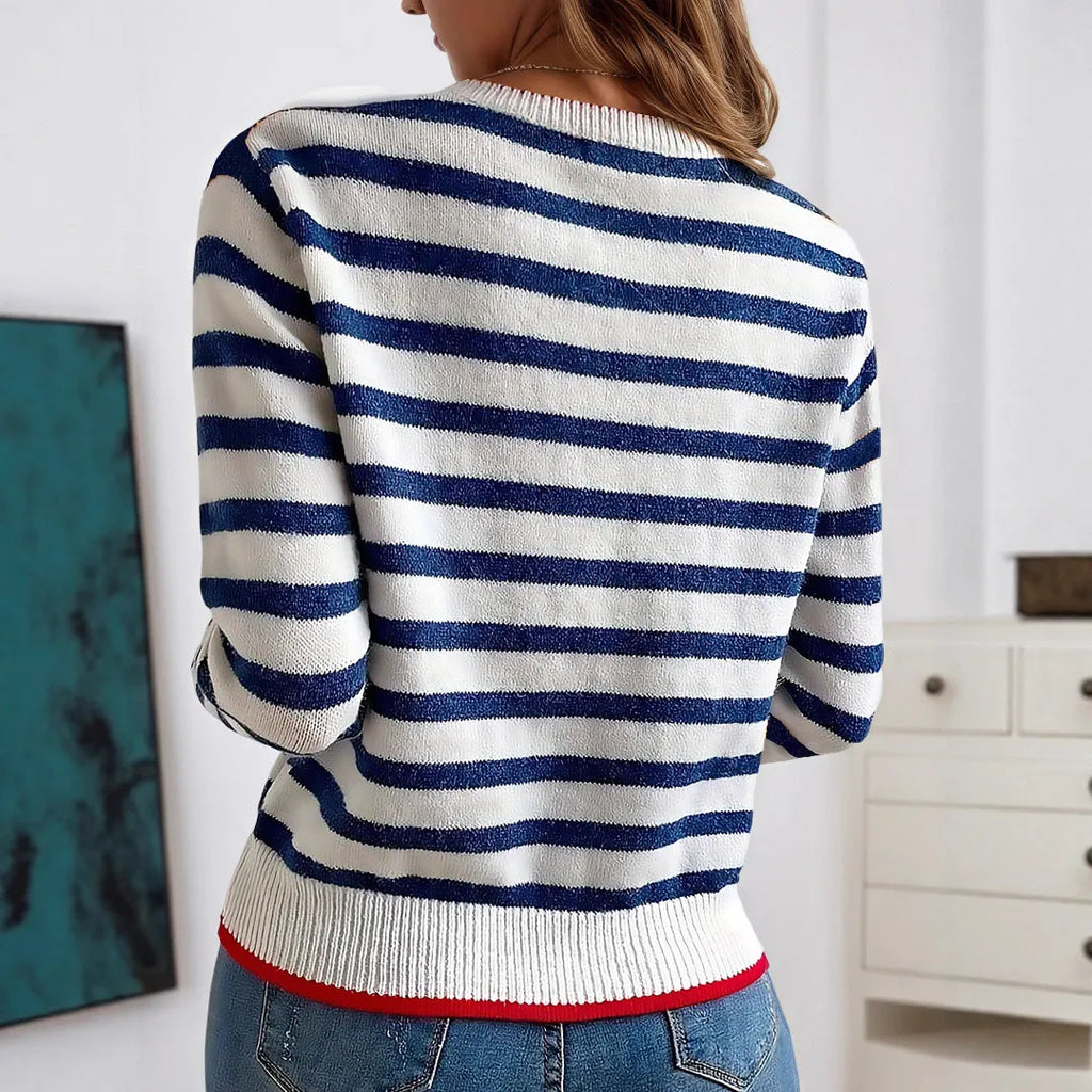 Sapphire blue loose-fit striped knitted pullover jumper with round neck and long sleeves.