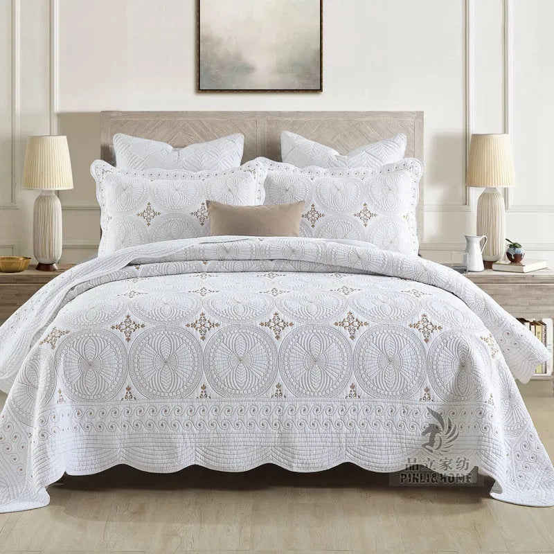 Pure cotton embroidered bed cover set with pillowcases on a double bed.