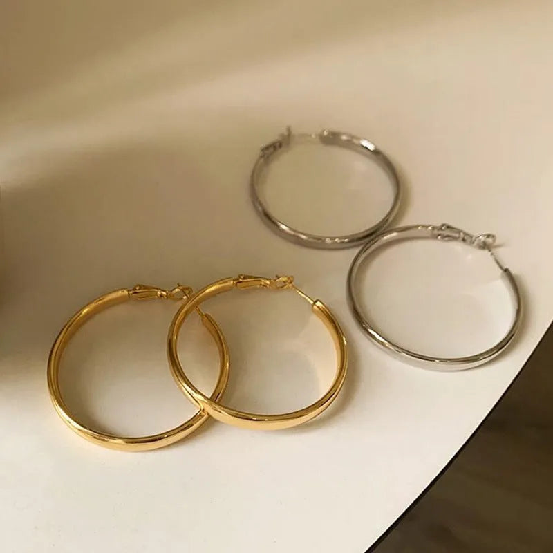 40mm circular metal earrings in gold and silver electroplated finishes