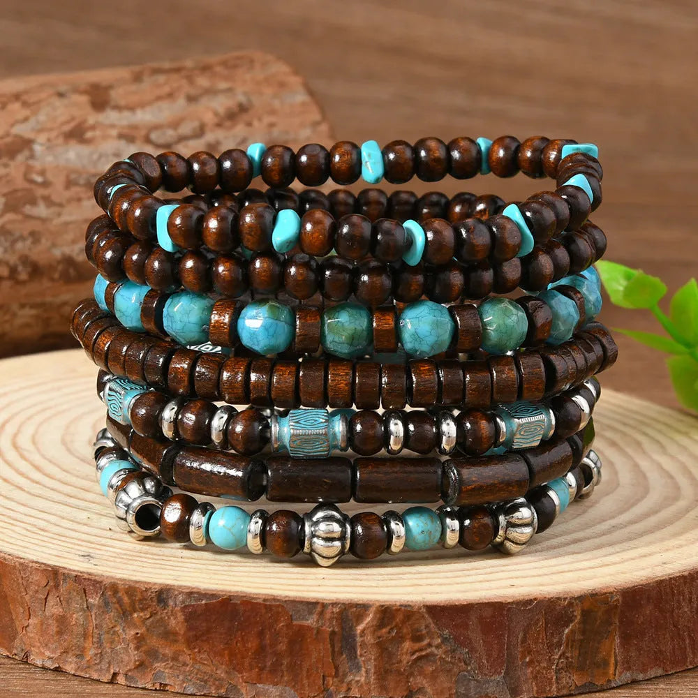 Set of seven multicolour retro bracelets with wooden beads and alloy details.
